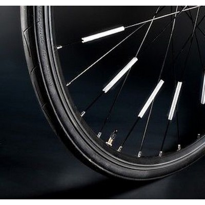 Reflective bicycle overlay to spokes