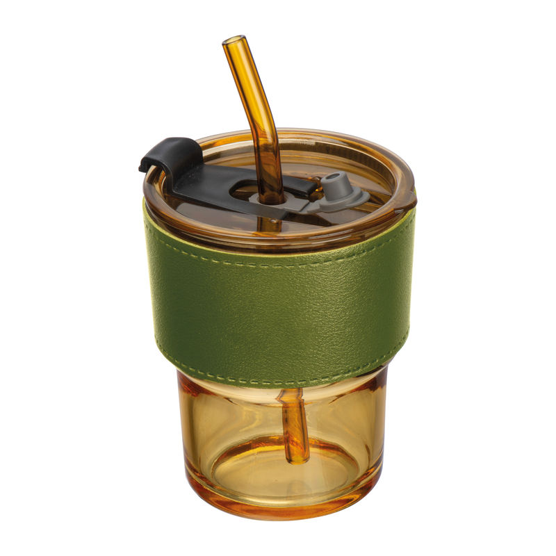 Coloured drinking glass with glass straw